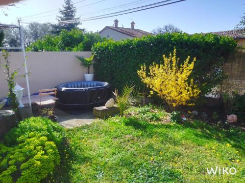 Pretty holiday home with garden and hot tub