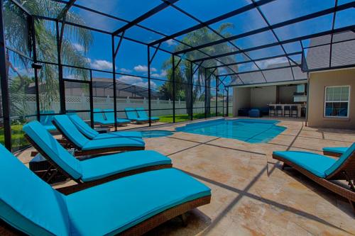 Mickeys Atlantis - Luxury 8BR Mansion Oasis Pool Hot Tub Outdoor Kitchen Home Theater, Game Room & More! 2 Miles to Disney image