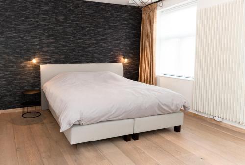 Boonuz guesthouse, luxe duplex vakantiehuis in centrum Ieper met privé lounge terras en IR sauna