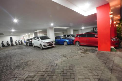 a car parked in a garage next to a building, DPARAGON SONGGOLANGIT in Malang