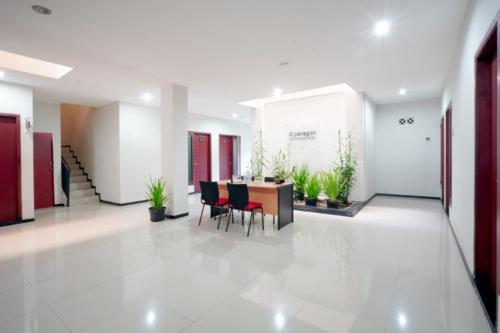 a room with a table, chairs, and a large window, DPARAGON SONGGOLANGIT in Malang