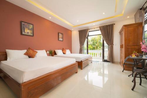Family Room with Balcony room in Spring Garden Villa Hoi An
