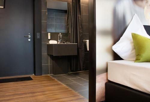 Bathroom, NHI Hotel by WMM Hotels in Neuhaus am Inn