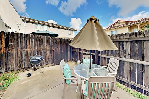 Downtown Retreat - Patio with Grill - Walk Beach Duplex - main image