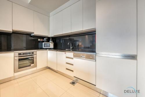 Exquisite 1BR at The Address Residences Dubai Marina by Deluxe Holiday Homes, Dubaj (fotografie 5)