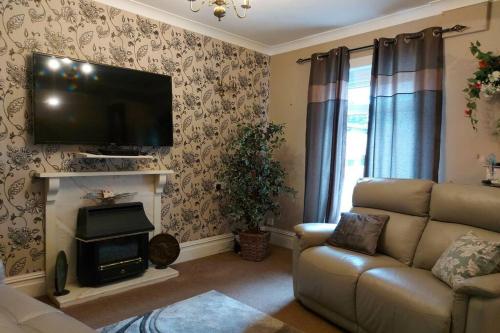 Bungalow with large rear garden, close to beach.