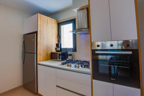 Luxury Condo with private Picuzzi just steps from the beach - A202