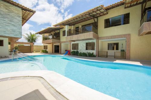 Vila com 4 casas na praia de Cotovelo por Carpediem
