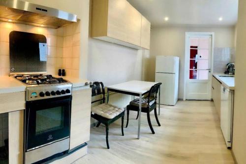 Kitchen, Cosy house in the heart of the center! in Oostburg