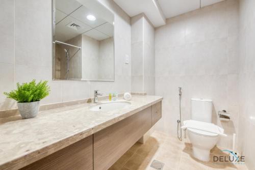 Sunny 1BR at Canal Residences West Dubai Sports City by Deluxe Holiday Homes, Dubaj (fotografie 7)