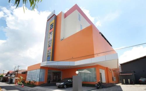 a large building with a sign on the side of it, Sakura Manado in Manado