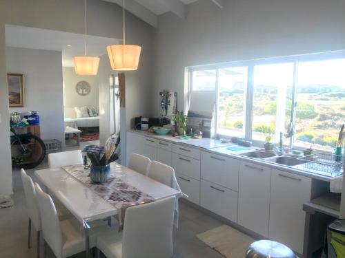 HIDDEN GEM A unique Golf Estate, Game Reserve north facing 6 sleeper 3 en suite bedrooms with 12m So in Langebaan Country Estate