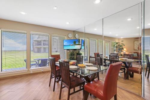 NEW LISTING! Ground floor beachfront beauty! Steps to the beach and pool - main image