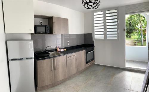 Kitchen, Karaibes Residence in Gosier