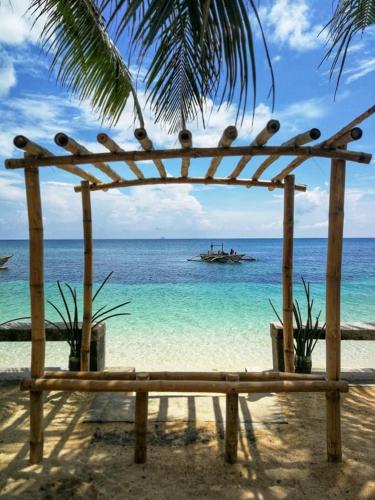 . One Beachfront Room in Daanbantayan with Stand fan