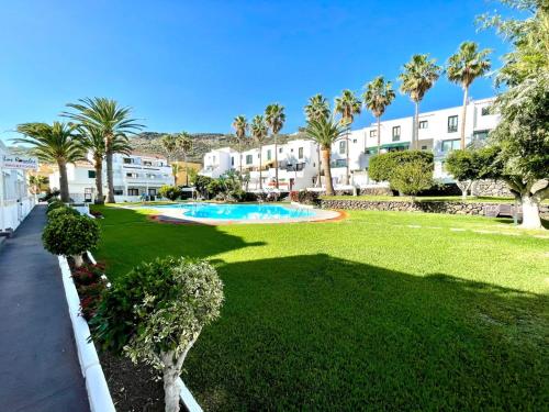 Acogedor apartamento de 1 dormitorio, vistas a la piscina, Wifi, cerca playa en Los Cancajos