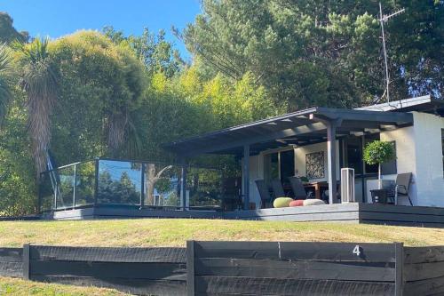 Relax in the spa with views opposite Lake Eildon