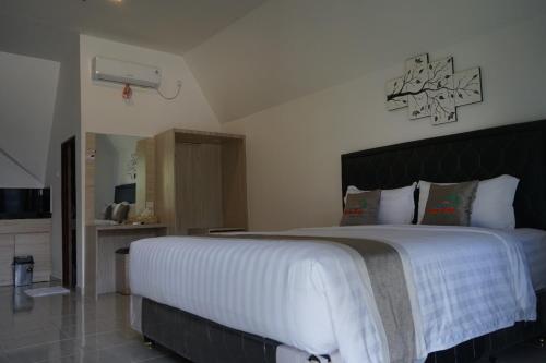 Madu Tiga Beach & Resort Room Type - Family Room with Garden View Madu Tiga Beach & Resort Room Type - Family Room with Garden View