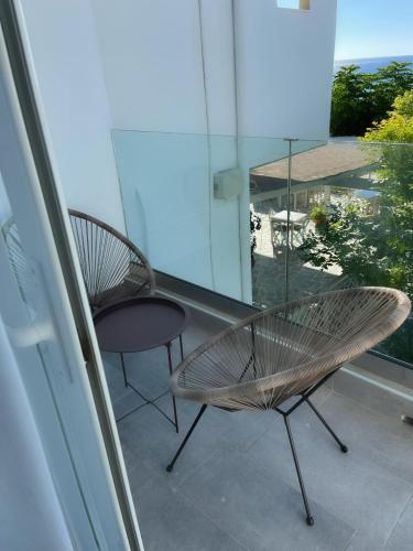 Delfini Beach Hotel & Suites Delfini Beach Hotel & Suites