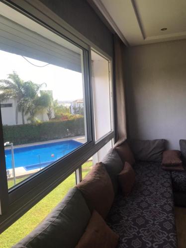 Bel Appartement a PUERTO MARINA-DAR BOUAZZA avec piscines et jardins