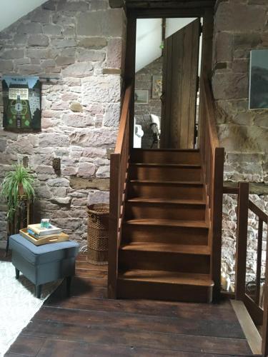 Historic converted byre in courtyard of 16C house