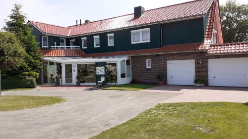 Viesnīcas āriene, 80 qm Ferienwohnung für die Familie in Ostfriesland zu Superpreisen (80 qm Ferienwohnung fur die Familie in Ostfriesland zu Superpreisen) in Utarp