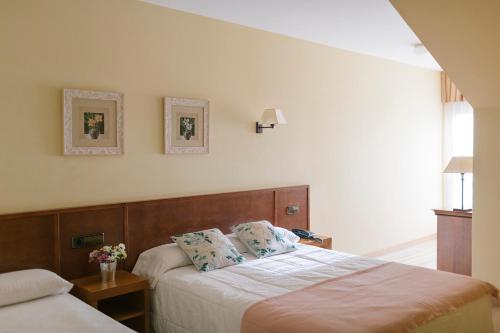 Habitación triple, vistas al mar