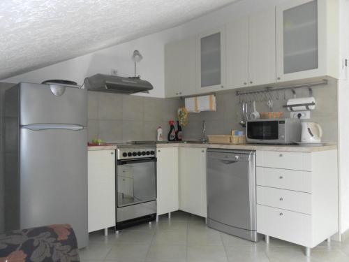 Kitchen, Apartments David in Perast