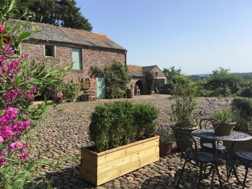 Historic converted byre in courtyard of 16C house