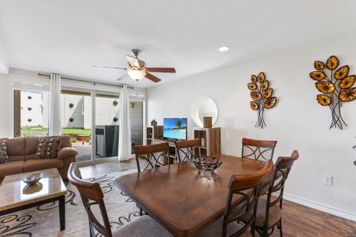 NEW LISTING! Ground floor with spacious patio! Steps to the beach and pool - main image