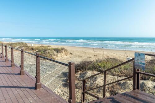 NEW LISTING! Ground floor with spacious patio! Steps to the beach and pool - image 5