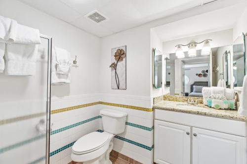 NEW LISTING! Ground floor with spacious patio! Steps to the beach and pool - image 8