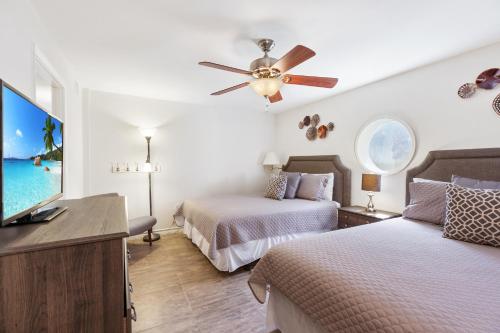 NEW LISTING! Ground floor with spacious patio! Steps to the beach and pool - image 11