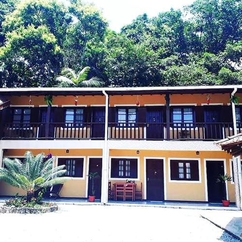 Suite aconchegante dentro de uma pousada em Paraty – khách sạn tại Pantanal