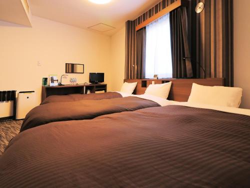 Chambre triple, 3 lits