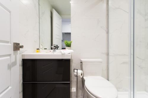 Serene and Styled Little Italy Studio full bath by Den Stays