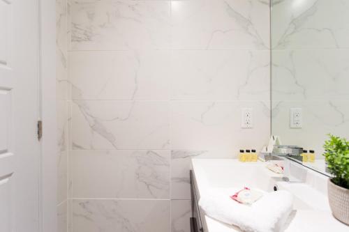 Serene and Styled Little Italy Studio full bath by Den Stays