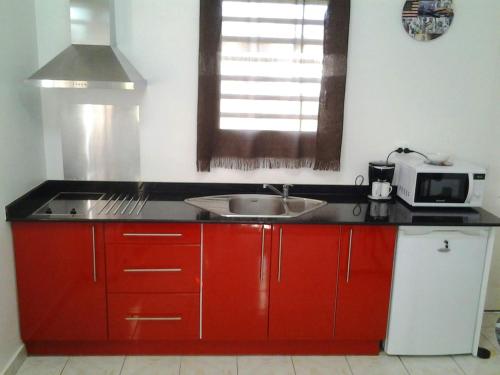 Κουζίνα, Maison chaleureuse à Le Moule avec piscine partagée (Maison chaleureuse a Le Moule avec piscine partagee) in Λε Μούλ