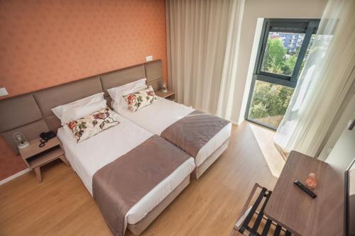 Essence Inn Marianos - Tap to explore photos