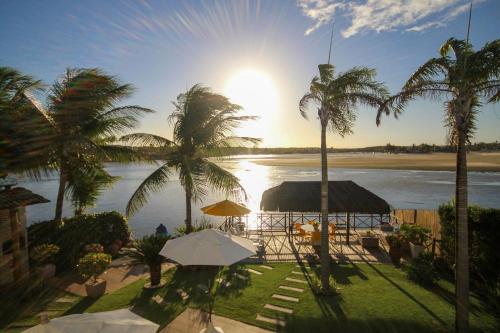 Casa Pé na areia na Praia de Genipabu por Carpediem