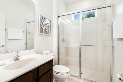 Solterra Stunner- 6 bedroom home with a south facing pool overlooking lagoon game room in a gated resort - image 11