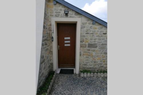 Maison séjour spacieux lumineux avec jardin et extérieur aménagé terrain de petanque proche Omaha beach, Grandcamp Maisy et pointe du Hoc