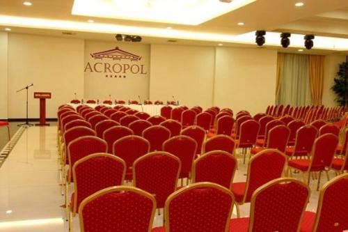 a room filled with lots of tables and chairs, Acropol Hotel in Serrai