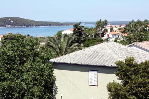 Apartments and rooms with parking space Barbat, Rab - 5070