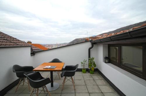 Blue apartment over Prizren roofs