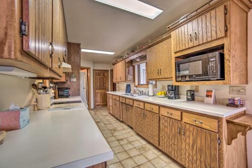 Riverfront Oconto Cabin with Fire Pit and Yard! in Oconto, USA