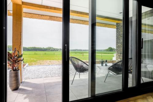 Erkély/terasz, B&B De Scheersehoeve in Gramsbergen Kern