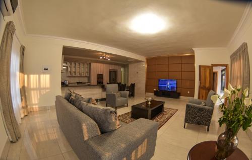 Shared lounge/TV area, Apartment Two-One-Two Eleven in Gaborone