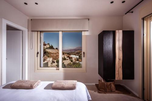 Kamilari Luxury Residences - Tap to explore photos