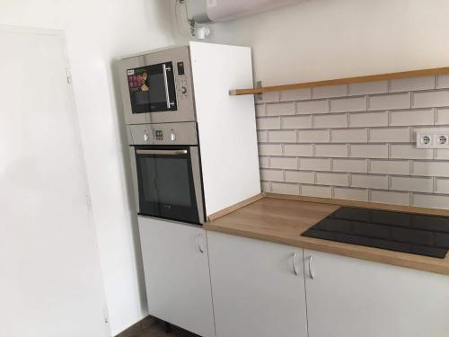 Kitchen, Cuki Apartmanok in Dombovar
